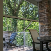 retractable screen on an outdoor room deck