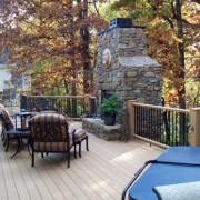 GeoDeck composite deck with stacked stone fireplace