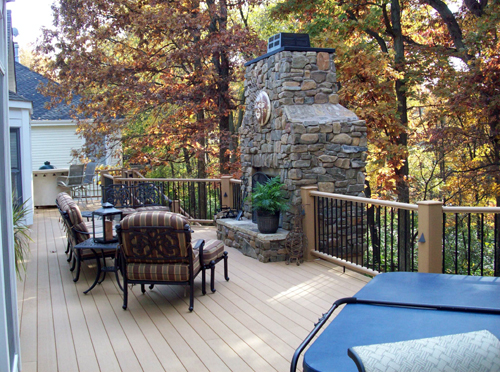 GeoDeck composite deck with stacked stone fireplace