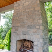 fireplace feature in an outdoor room