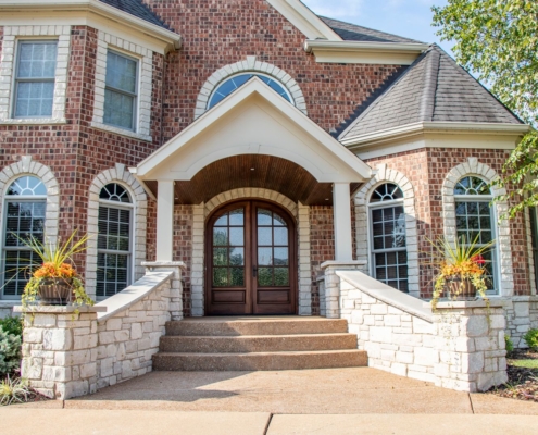 grand front entrance that helps boost homes value and curb appeal