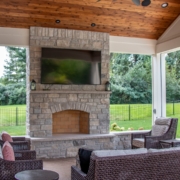 Fireplace feature in an outdoor room pool house