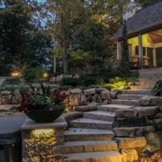 Outdoor space with custom steps leading to an outdoor room