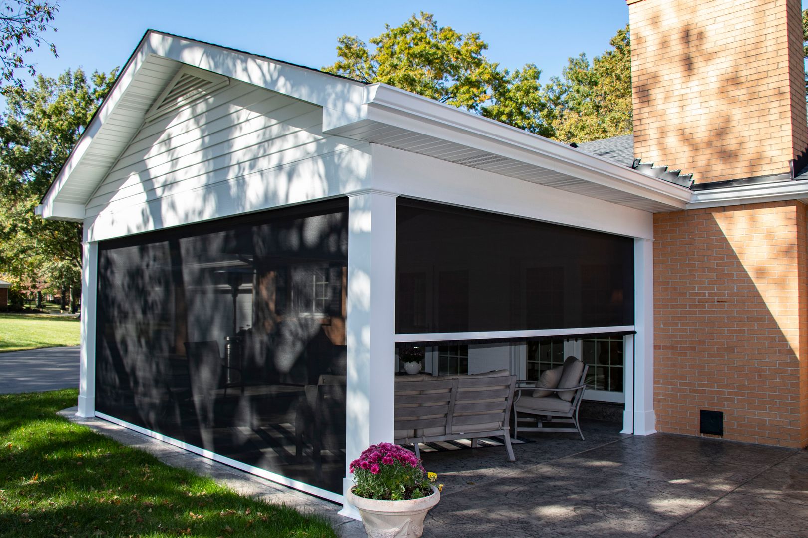 An outdoor room addition with three retractable screen walls