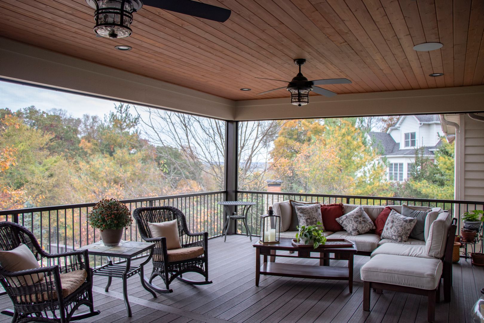 The interior of an outdoor screen room addition on a composite deck