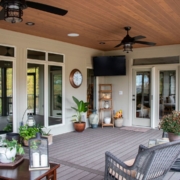 The interior of an outdoor screen room addition with composite decking