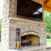 custom outdoor room fireplace with TV mount