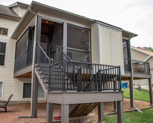 Outdoor screen room deck with a dog door