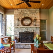 Outdoor screen room with a fireplace