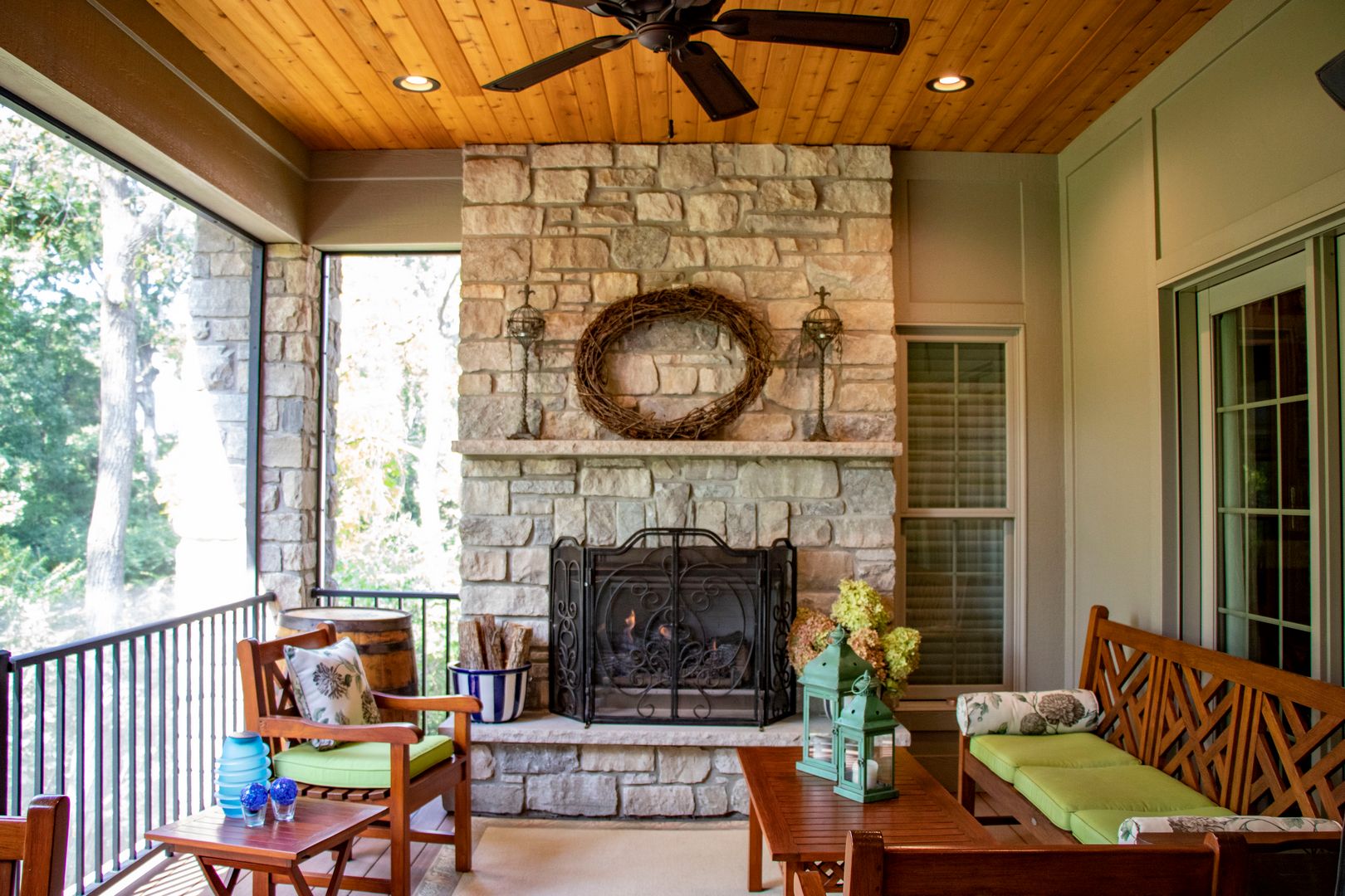 Outdoor screen room with a fireplace