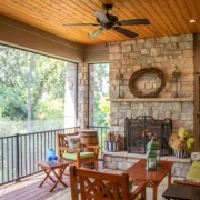 Outdoor screen room with a fireplace