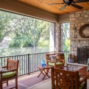 Outdoor screen room with a fireplace