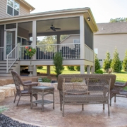 Outdoor patio next to a screen room porch