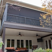 A custom screen room addition with a usable under deck drainage system