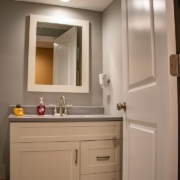 A full bathroom added into an unfinished basement that is now complete