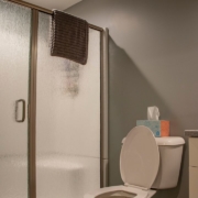 A full bathroom added into an unfinished basement that is now complete