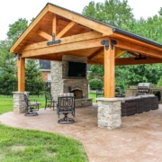 outdoor room located on a custom stamped concrete patio with a gorgeous fireplace feature