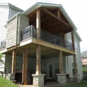 Outdoor room with fireplace and under deck patio