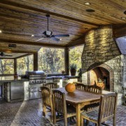 Outdoor Cooking area with stone fireplace