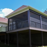 screen room addition with retractable solar screen.