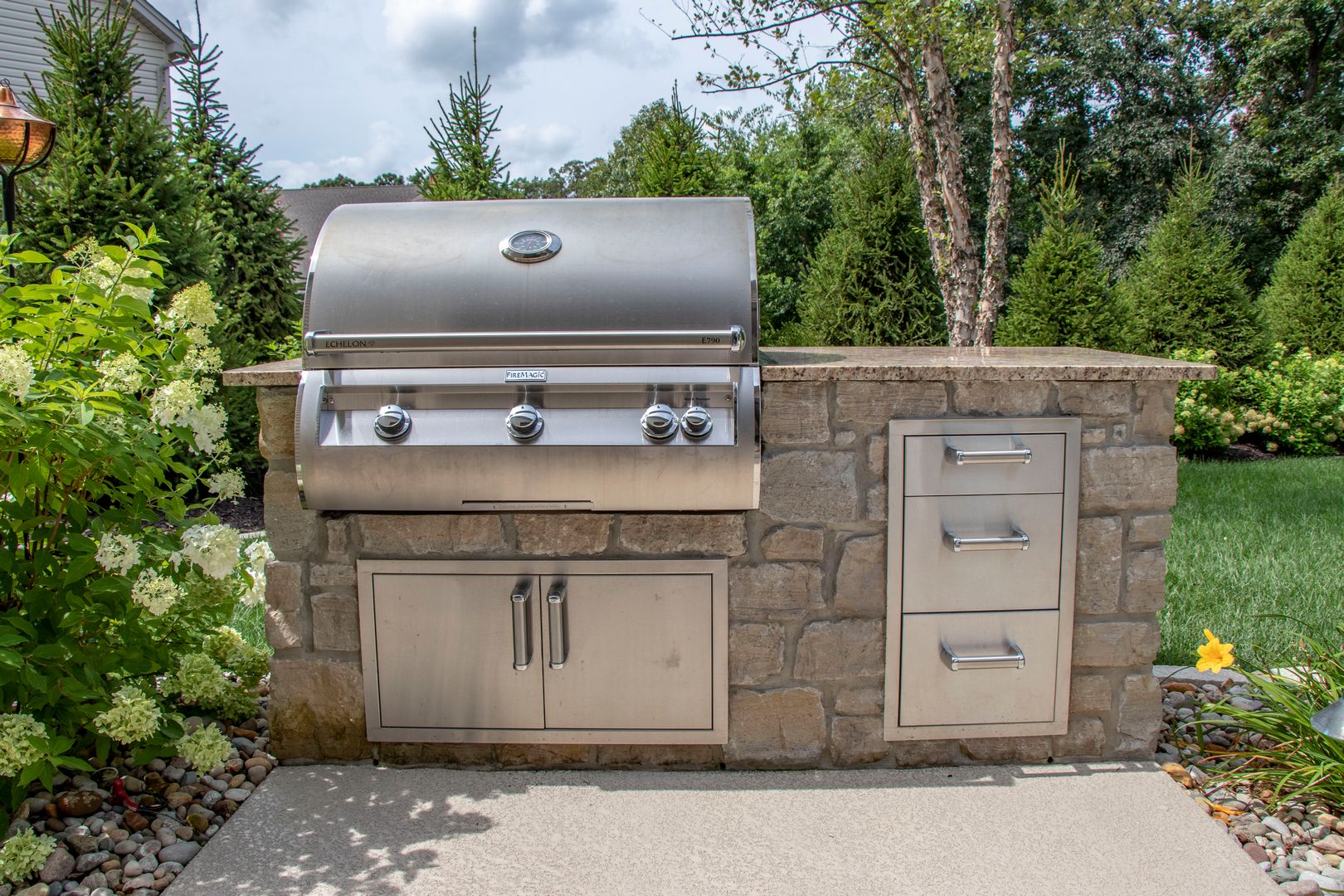 A grilling and storage center located outdoors