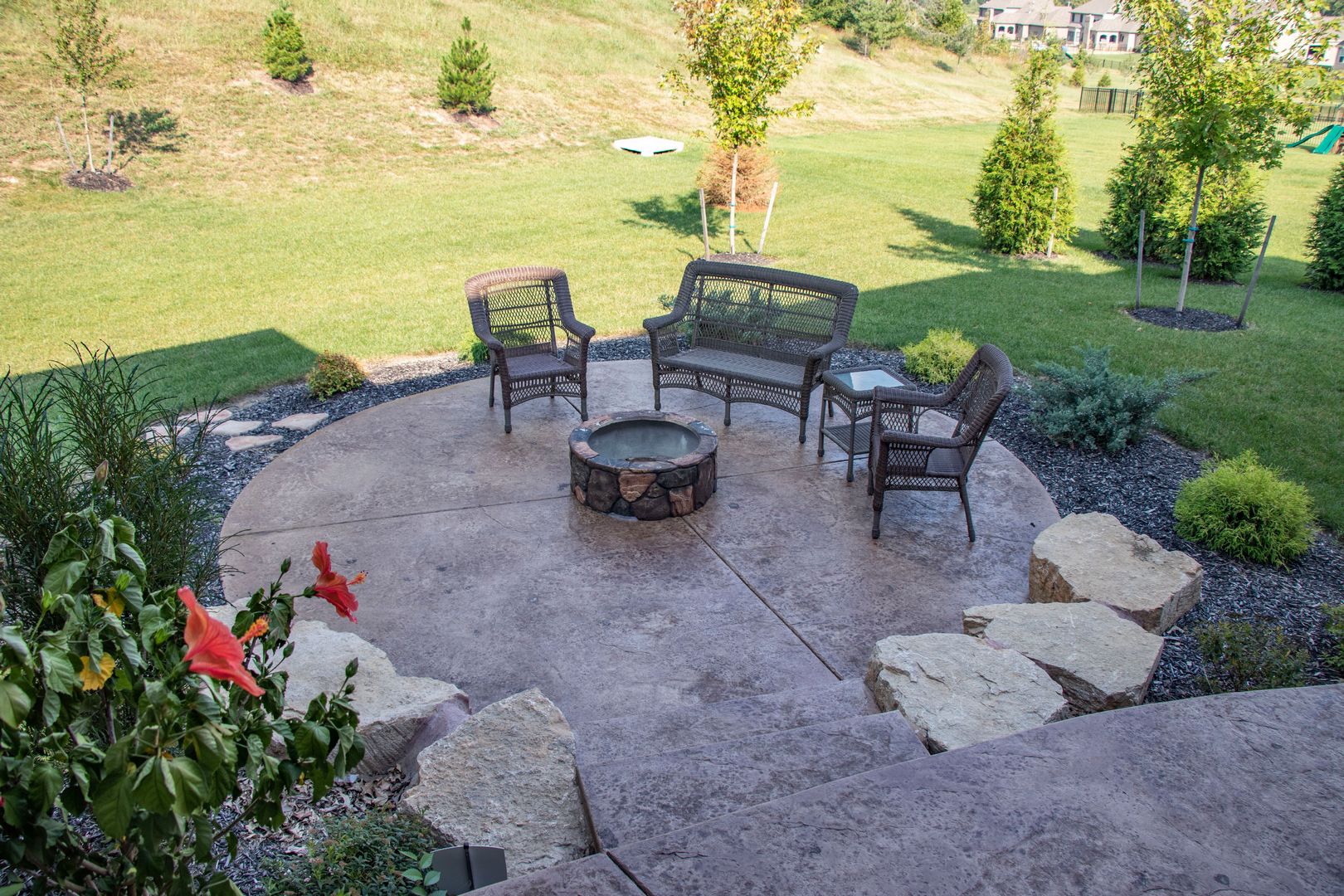 A beautiful custom patio with a fire pit perfect for any occasion