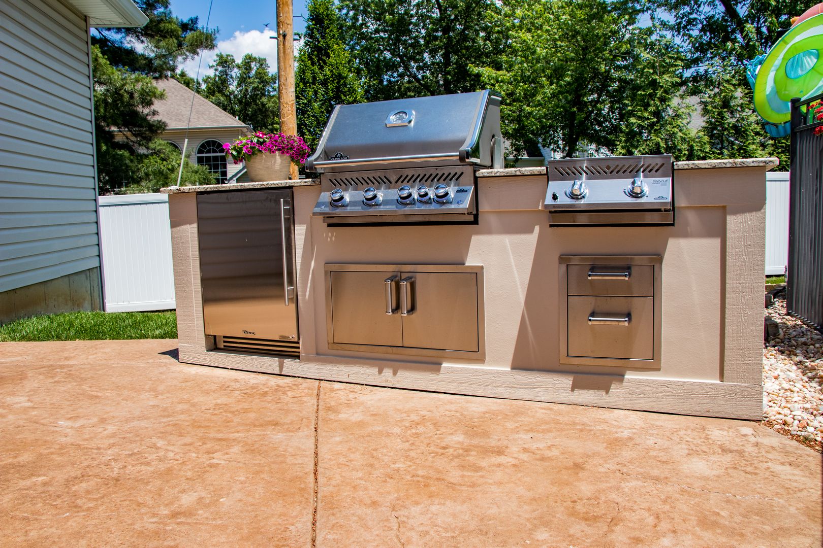 outdoor kitchen with grill and storage
