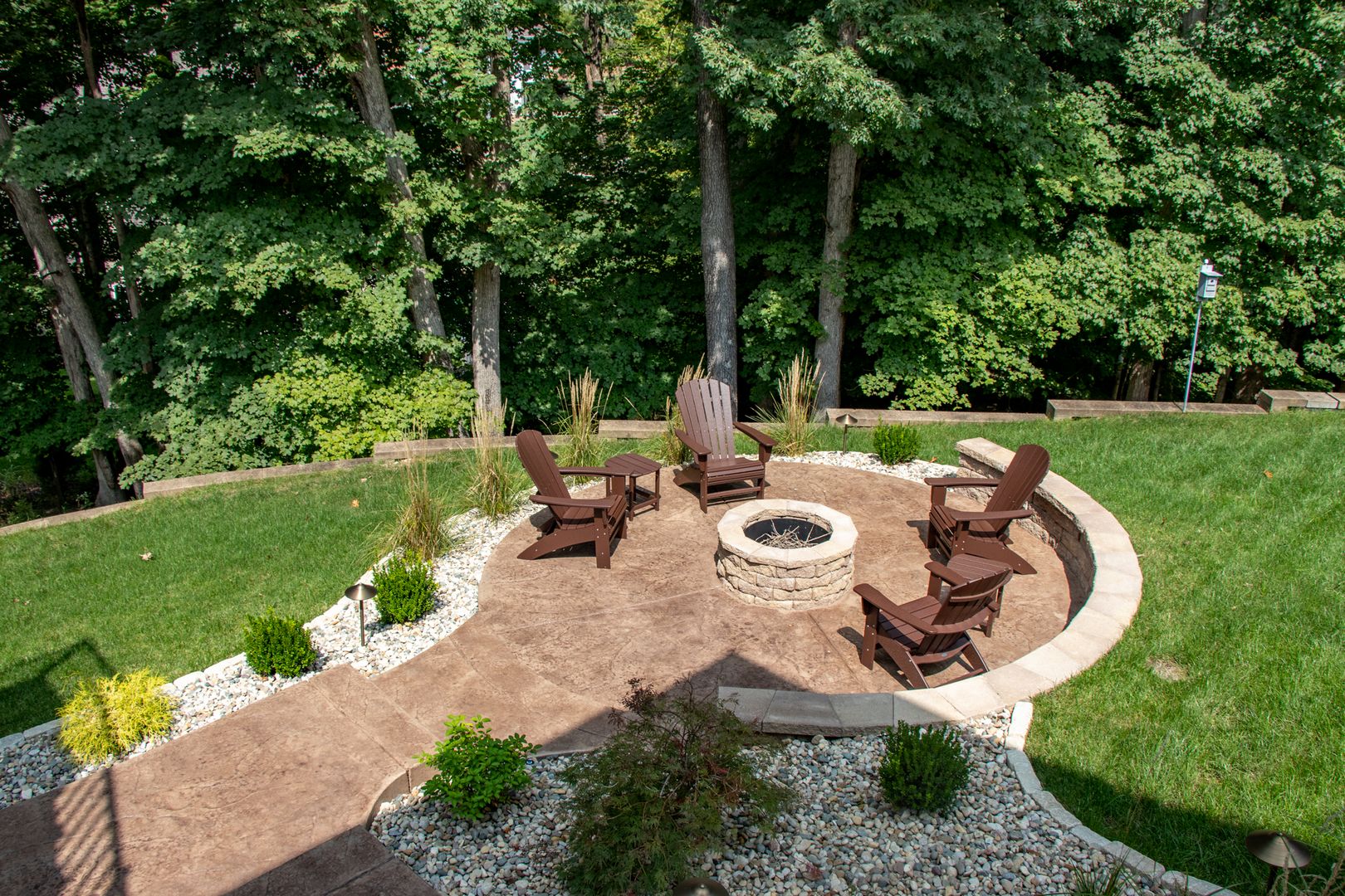 decorative concrete patio with fire pit