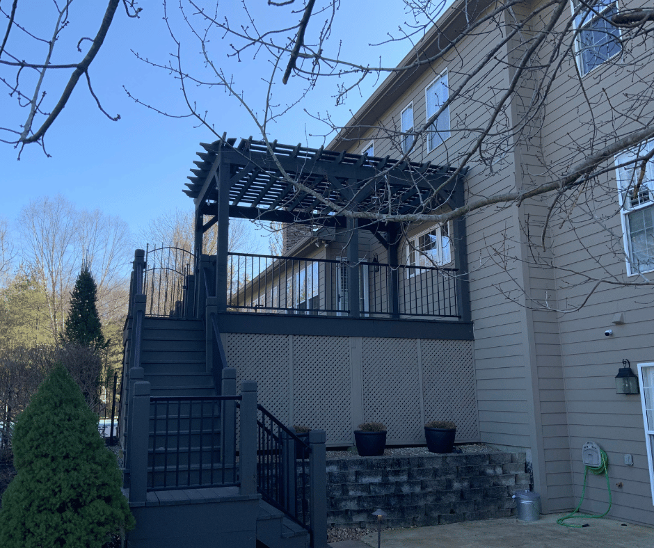 before photo of the multi level outdoor room with a two tiered fireplace