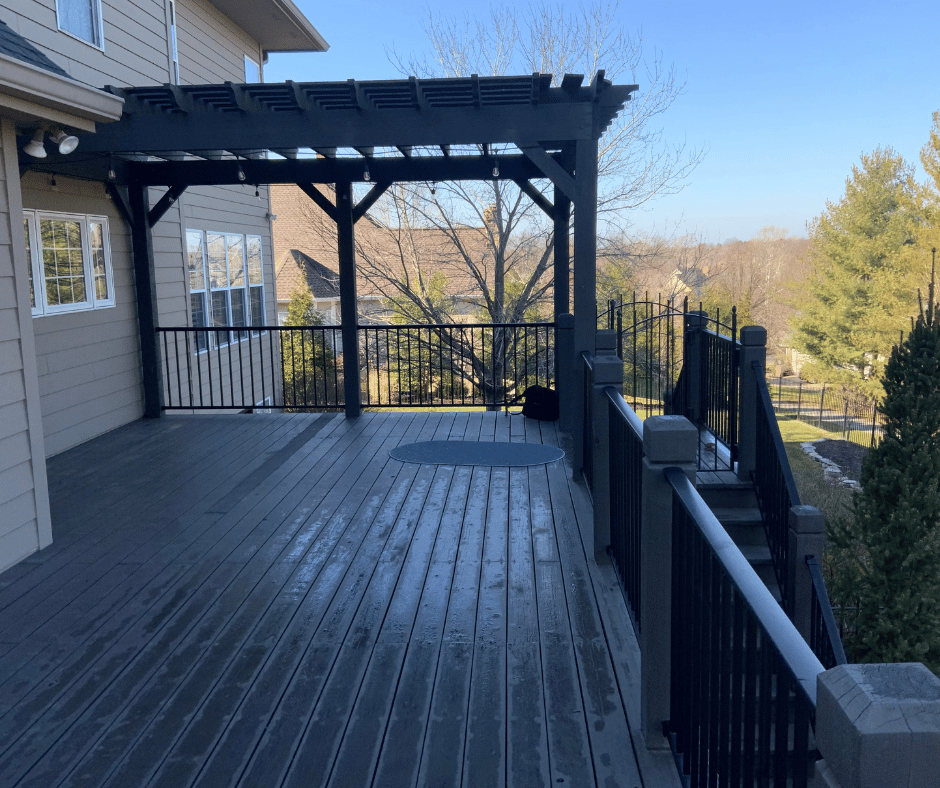 before photo of the multi level outdoor room with a two tiered fireplace