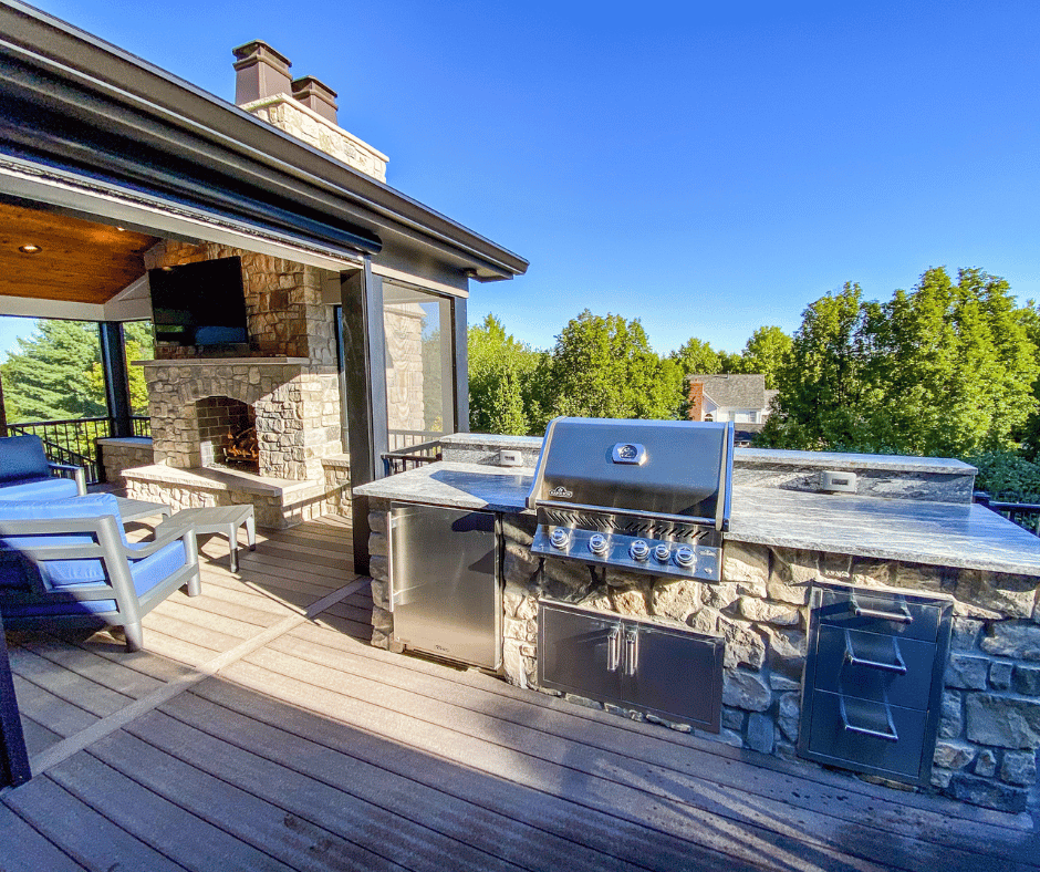 after photo of the multi level outdoor room with a two tiered fireplace